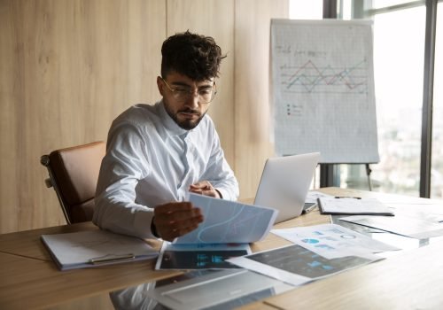 office-worker-using-finance-graphs